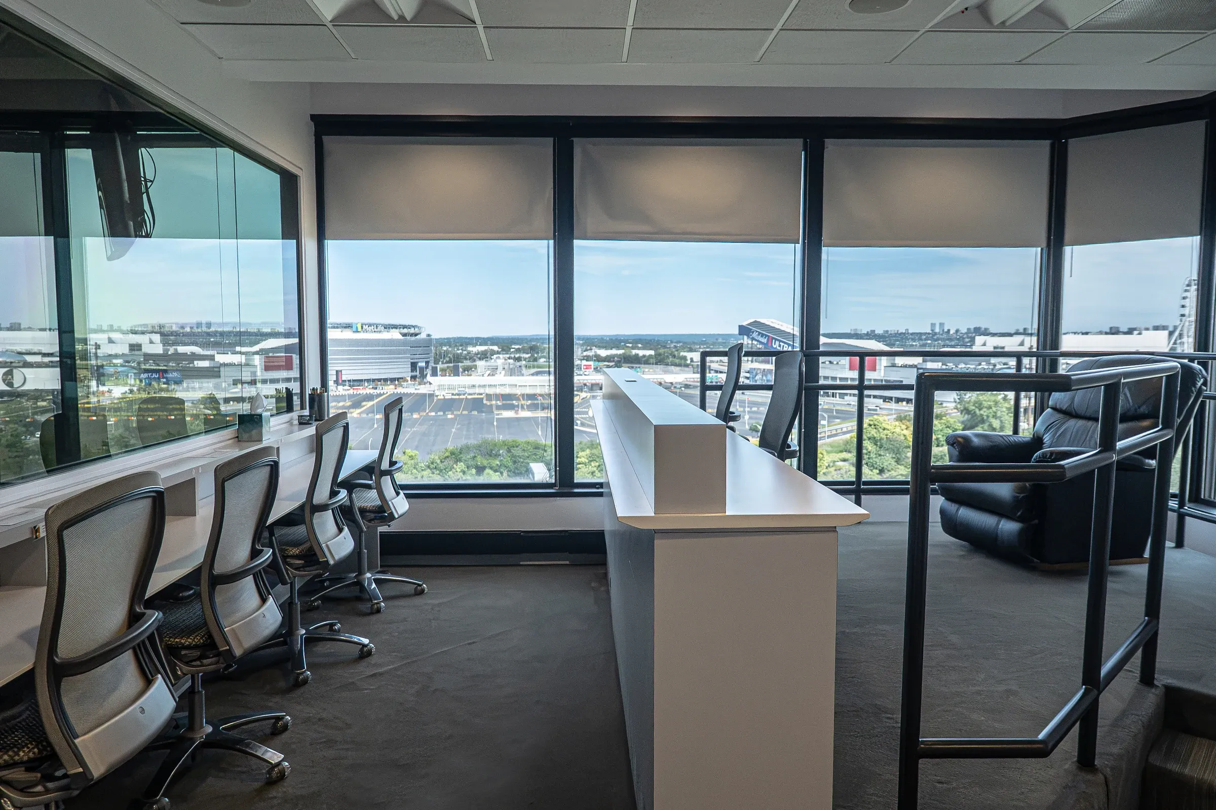 Stadium Suite tiered viewing room with observer desks and windows